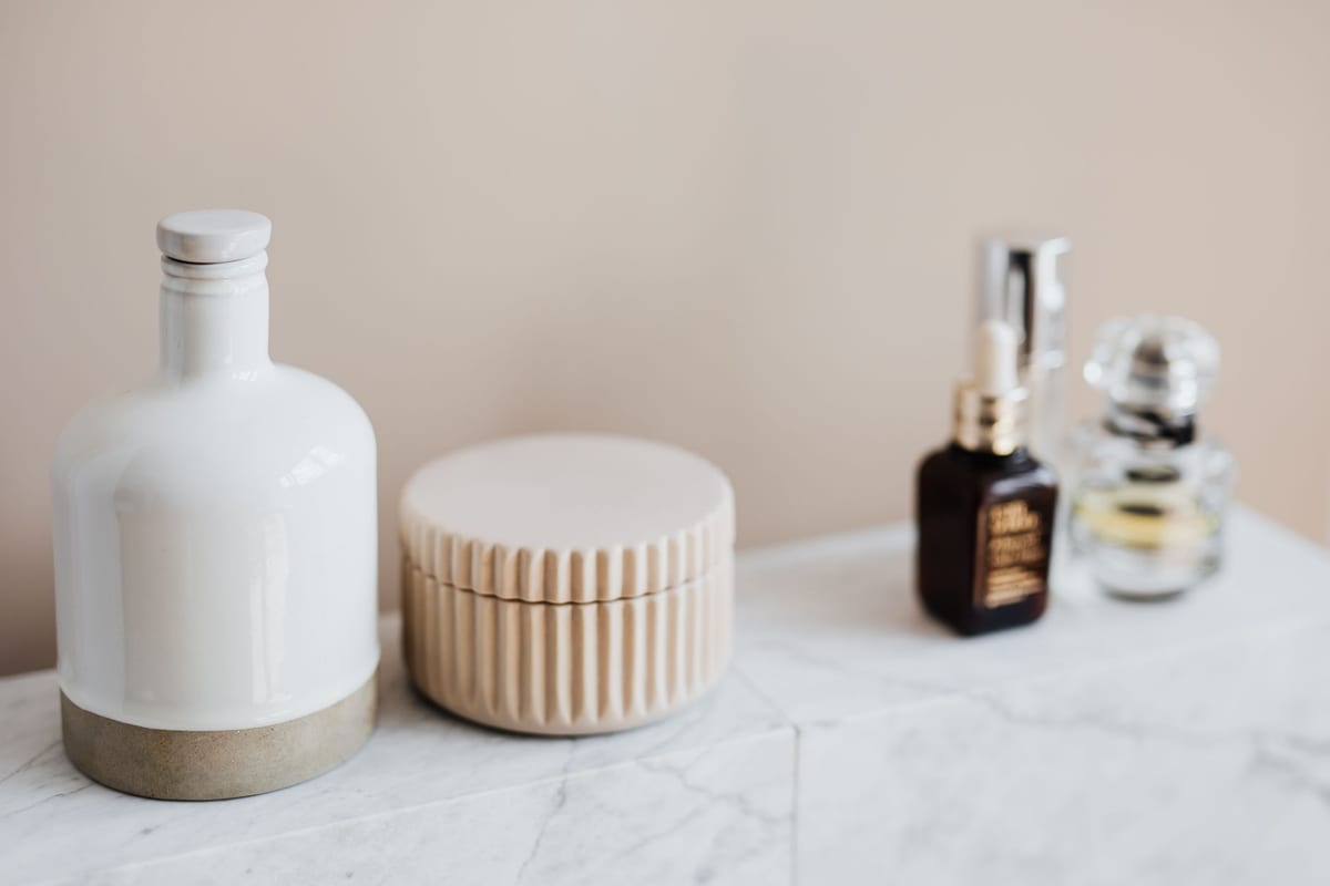Minimal bathroom shelf with skincare containers